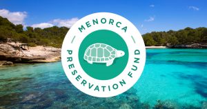 Photo of a beach, with the Menorca Preservation Fund logo over it.